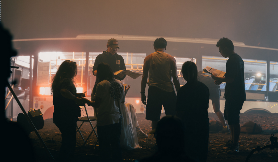 Students gathered around the LED wall during a hands-on shoot exercise
